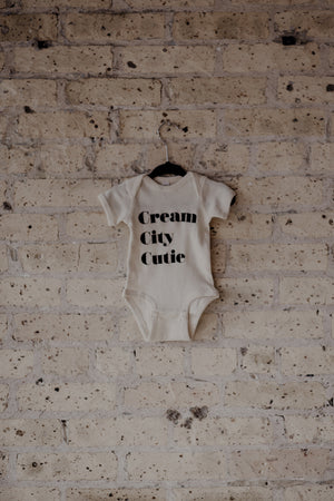 Cream City Cutie - Stacked Onesie ™️