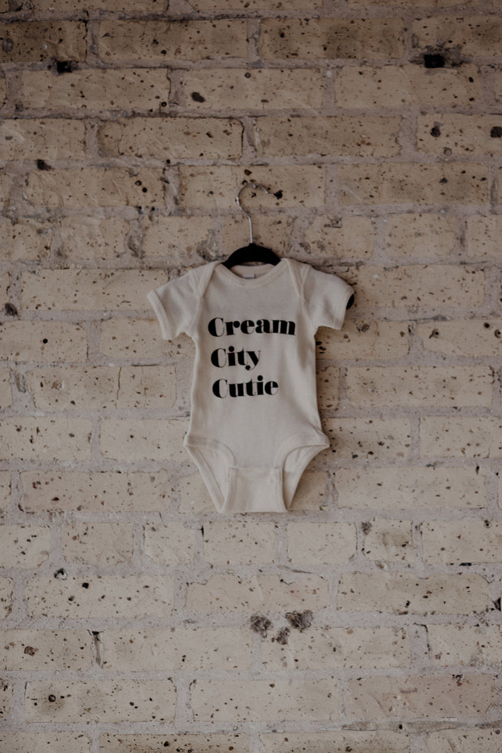 Cream City Cutie - Stacked Onesie ™️